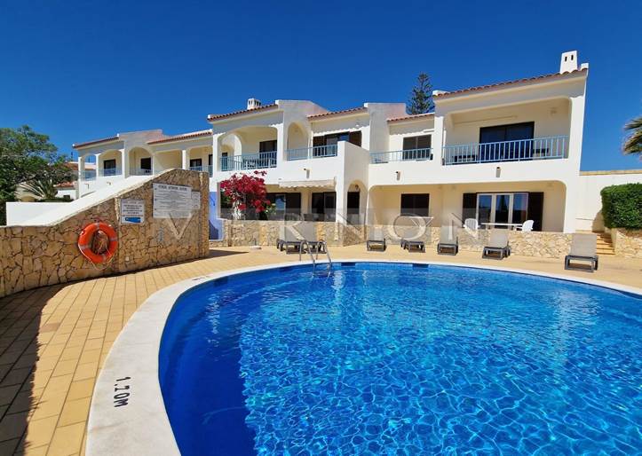 Algarve Carvoeiro for sale top floor 2-bedroom apartment with distant sea views and communal pool in Monte Dourado, only a short stroll to amenities and beach